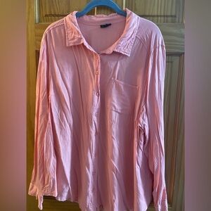 Light pink button down long sleeve shirt.